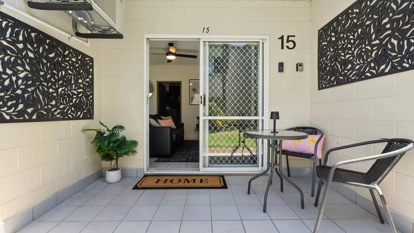 Private front patio with outdoor table and chairs