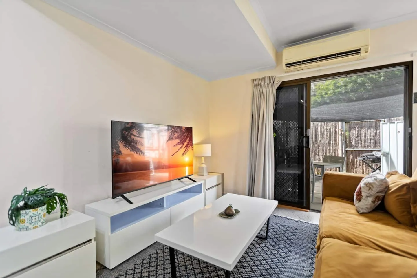 Renovated living room with smart TV and lounge