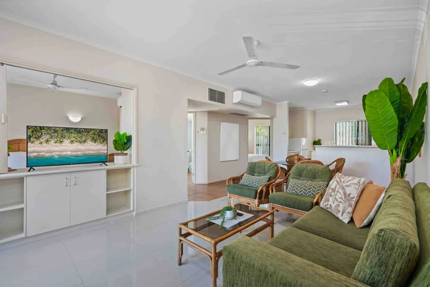 Living room with lounge, TV and dining area