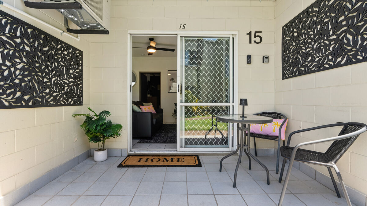 Front door of Unit 15 with the key safe on the wall to the right, next to the Ring doorbell